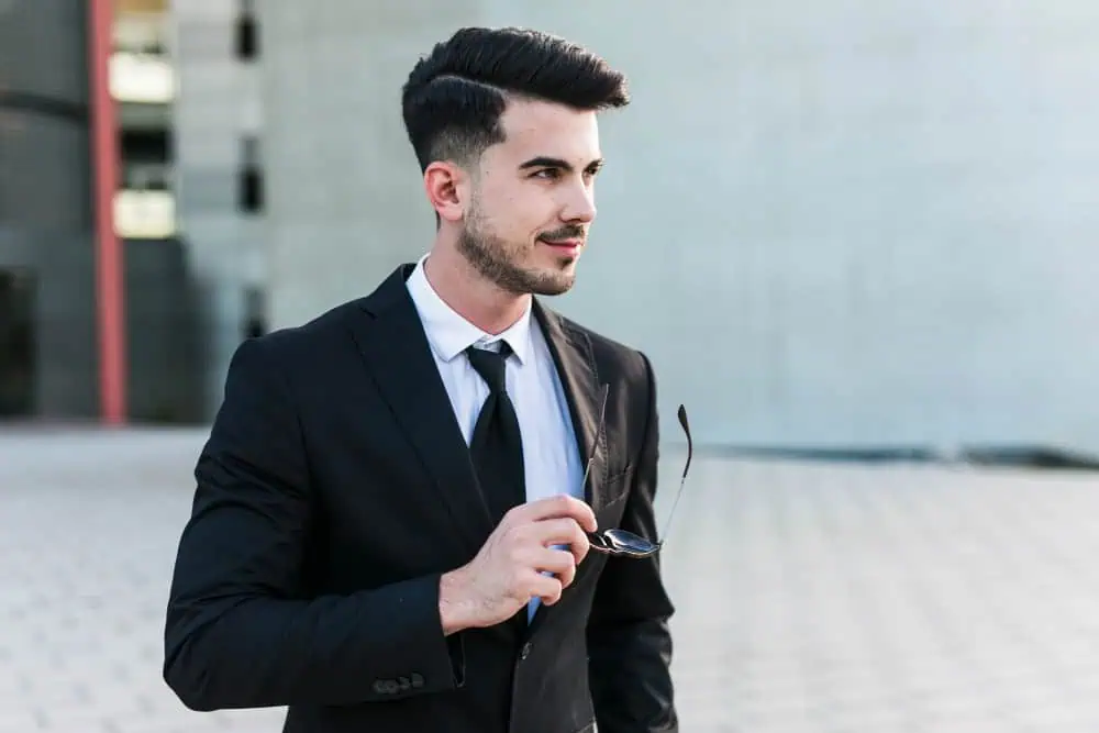 Man Holding Clipboard Inside Room